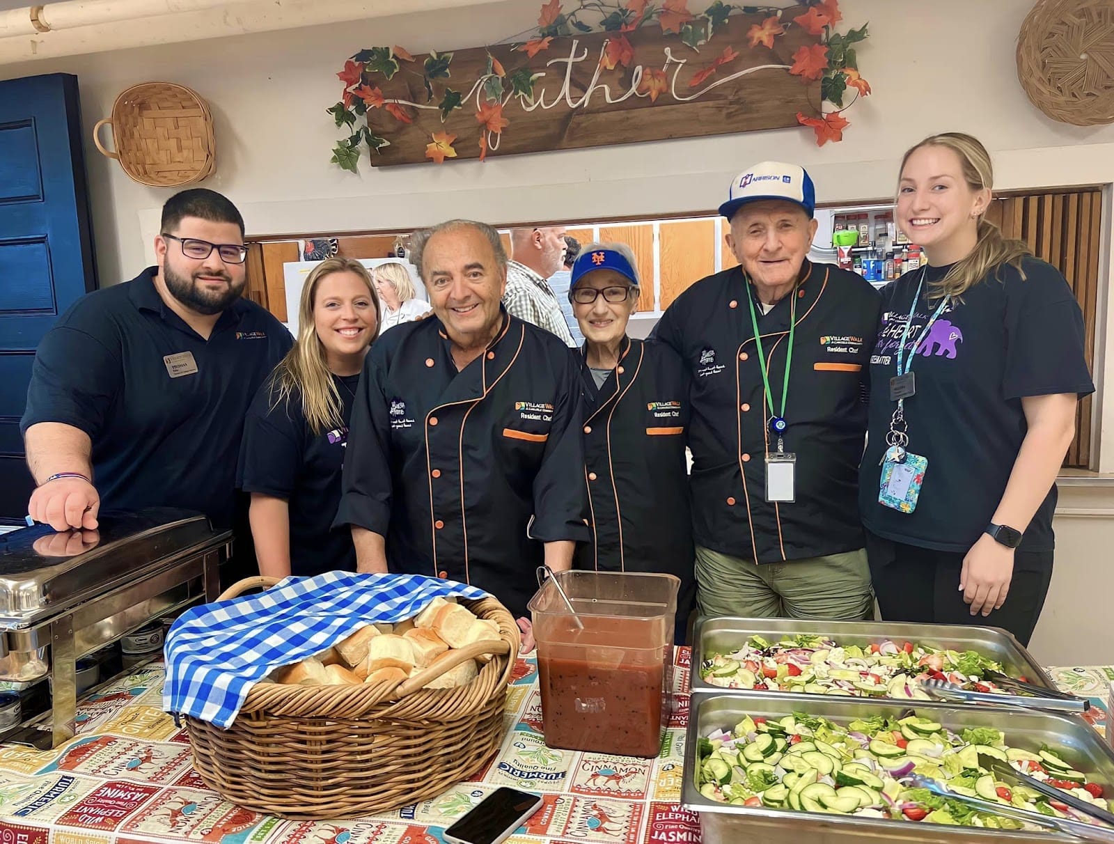 Seniors and staff smiling over home-made Thanksgiving food