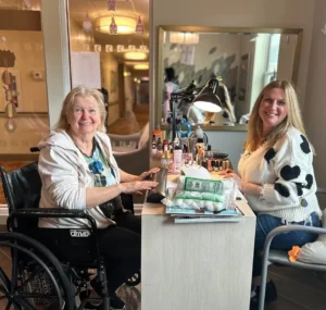 Senior woman getting manicure