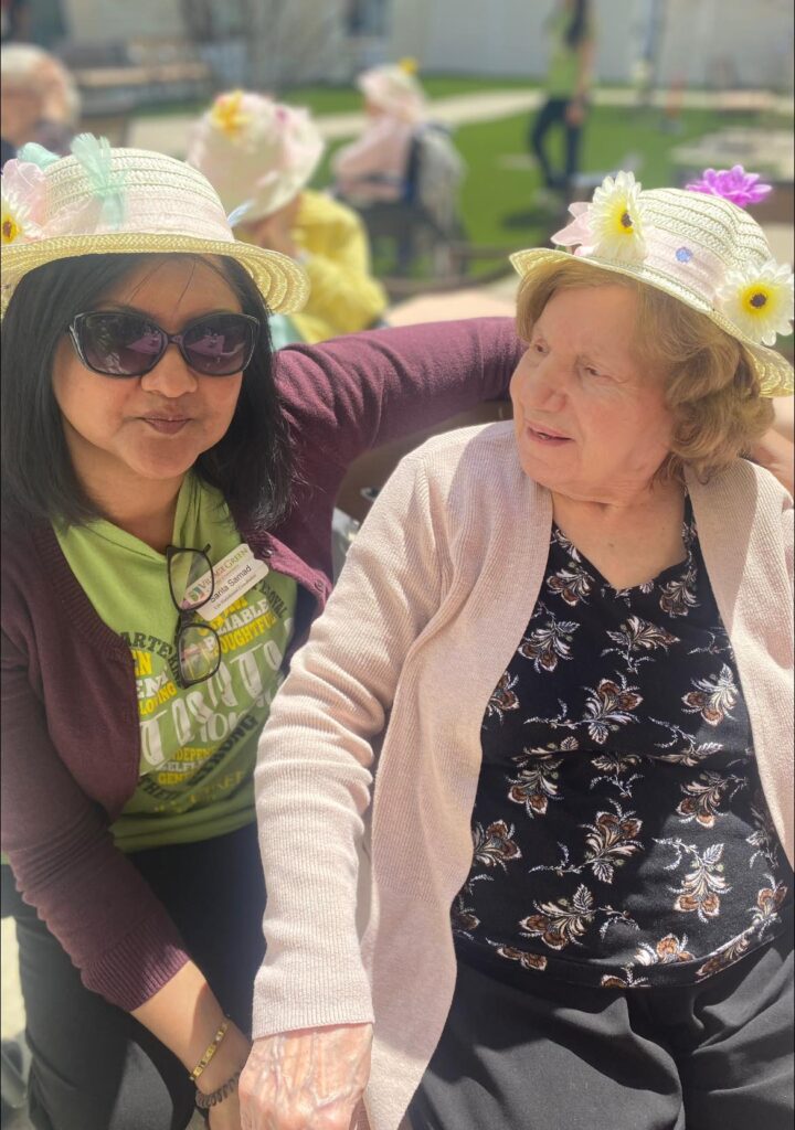 A dementia patient looking at a caregiver to their left