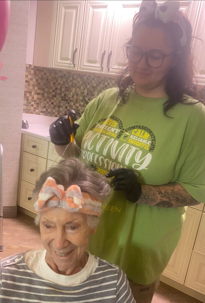 A senior smiling while receiving spa treatment